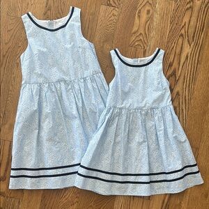 Matching Blue Floral Sleeveless Dresses with Navy Trim